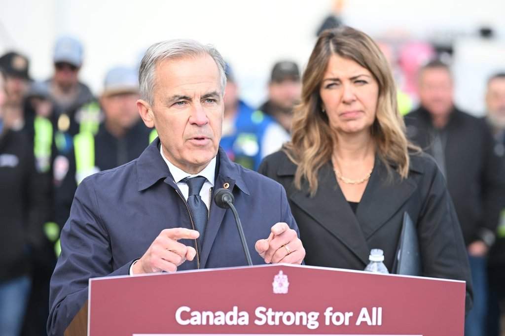 Mark Carney and Danielle Smith are at odds over immigration, among other referendum items. 