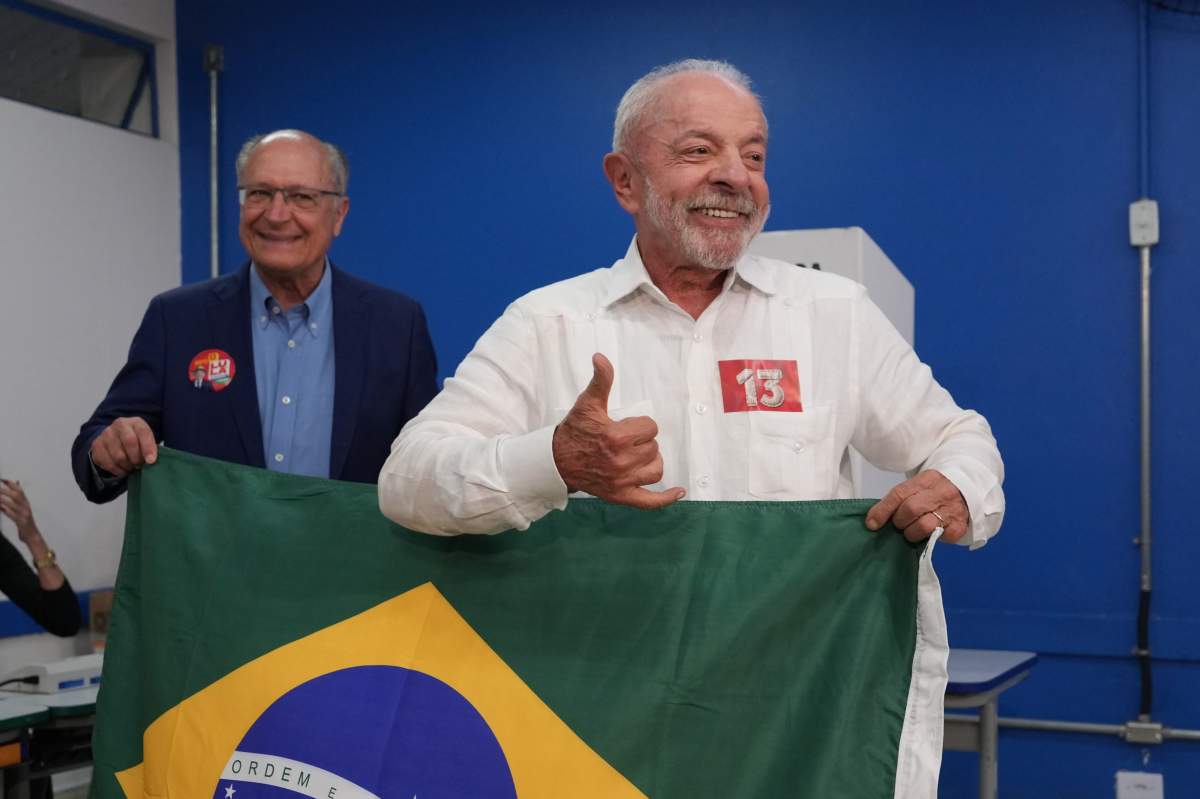 President Luiz Inacio Lula da Silva, who is seeking reelection, and his running mate, Geraldo Alckmin, display a Brazilian flag during the presidential runoff in Sao Bernardo do Campo, Brazil, Sunday, Oct. 25, 2026.