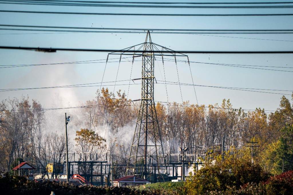 A plume of smokes rises from MC Tank Transport Inc., where a chemical tank exploded overnight, prompting hundreds of residents to evacuate or shelter in place amid concerns about a potential toxic release, Wednesday, Oct. 21, 2026, in north Toledo, Ohio.