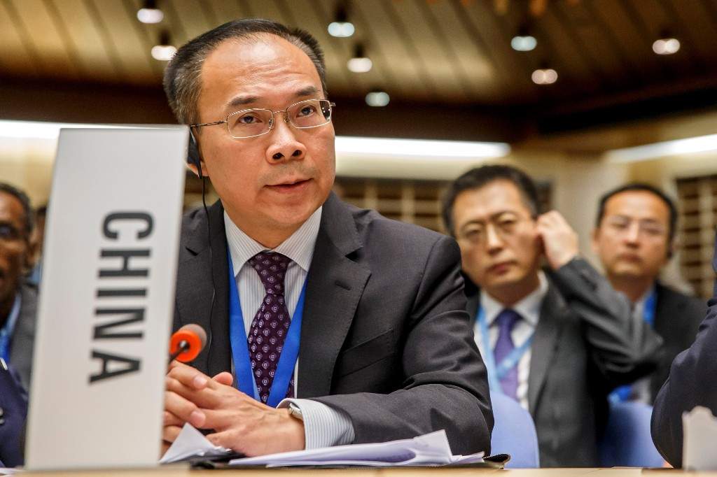 China's Ambassador Song Li asks the floor after moving a placard identifying his country, during the 146th session of the World Health Organization Executive Board, at the World Health Organization (WHO) headquarters in Geneva, Switzerland, Monday, Feb. 3, 2020.