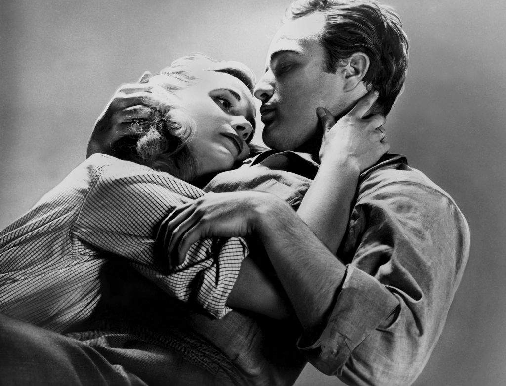 1954: Actor Marlon Brando and Eva Marie Saint pose for a portrait on the set of the movie ‘On the Waterfront,’ which came out in 1954.