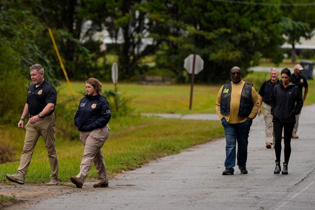 Authorities investigate the scene of a mass shooting where at least two people died and 35 were injured when struck by bullets Sunday morning, according to the Georgia Bureau of Investigation, Sunday, Oct. 4, 2026, in Vienna, Ga.