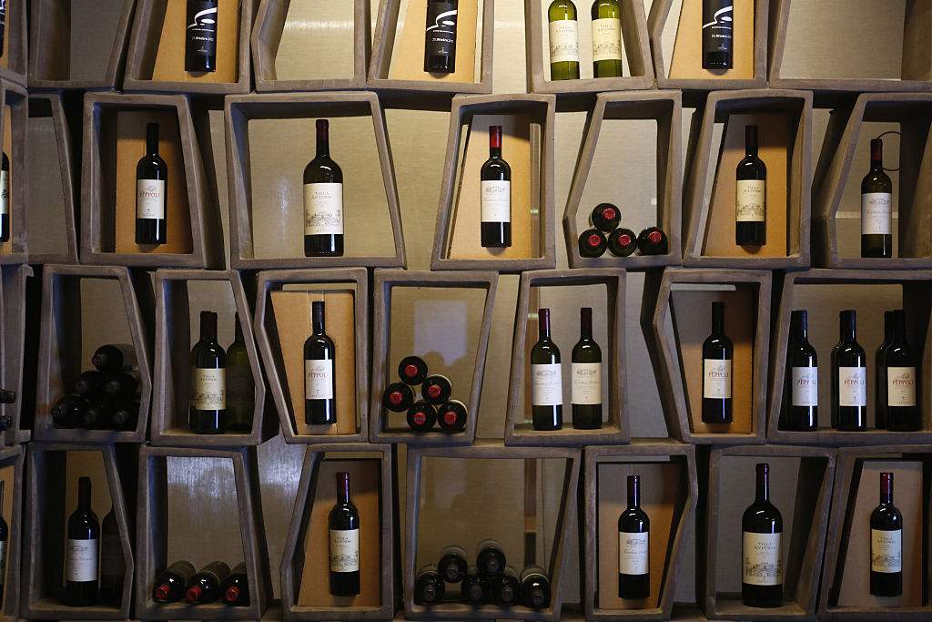 FILE: Bottles of wine, produced by Marchesi Antinori SpA, sit on display at the Antinori Cantine in Bargino, Tuscany, Italy on Friday, Oct. 7, 2016.