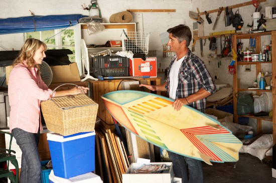 Couple discussing what to sell at yard sale