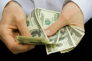 Man counting money before paying