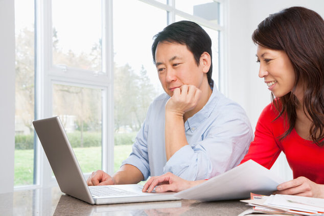 couple doing finances on computer