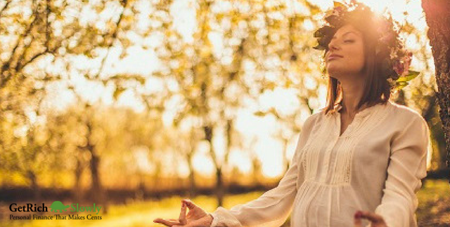 A photo of a pregnant woman meditating for article on mindful spending
